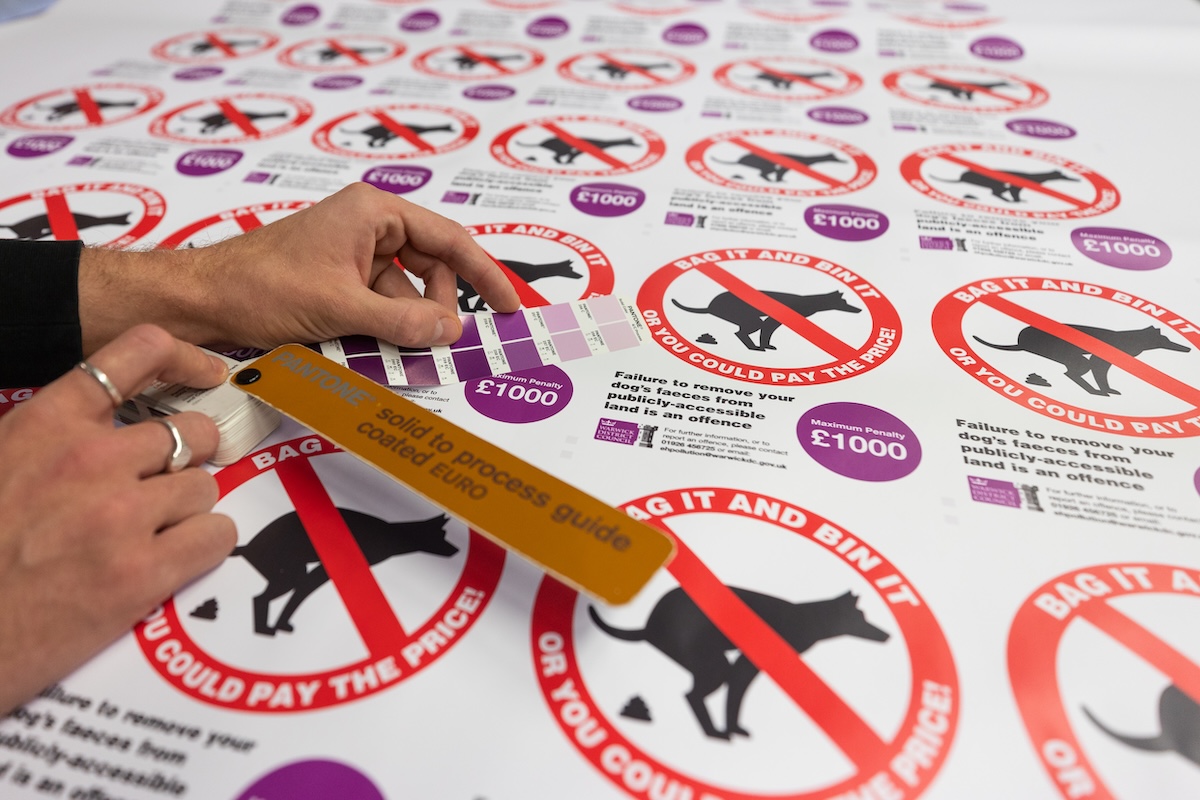 Dog poo bin stickers being colour matched.